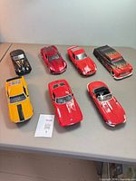 All seven diecast cars displayed closed