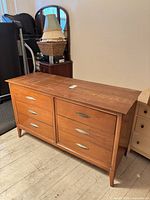 Full view of Dixie double dresser with six drawers and metal pulls