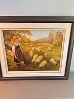 Framed pastoral oil painting showing overall composition