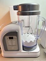 Generator with pitcher attached, control panel visible