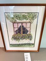 Front view of framed watercolor painting showing artwork, mat, glass and frame