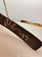 Blade showing Patrick Roy signature and #33 in silver marker