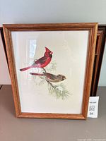 Framed print of two cardinals on pine branch