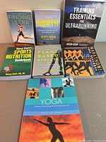 All seven paperback books arranged upright and flat showing full covers