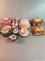 Group shot of entire lot showing cottage ware, blue reliefware, red transferware, and white pieces