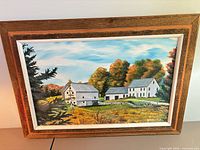 Front view of framed landscape painting