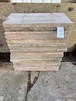 Front view of stacked sandstone pavers