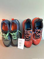 Front view of both pairs showing overall condition, colors, laces, size ticket