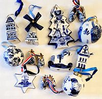 All twelve Delft blue and white porcelain ornaments displayed together