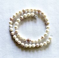 Coiled freshwater pearl necklace showing clasp and alternating pearl colors
