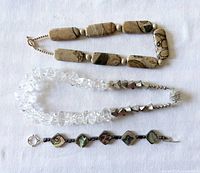 All three jewellery pieces displayed on white cloth