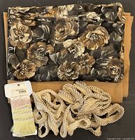 All lot contents: two folded wool fabrics, beige rope trim, card with assorted decorative trims