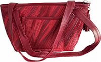 Front side showing stitched leather panels, exterior pocket, strap