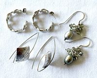All three pairs of sterling silver earrings displayed on white background