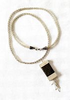 Full view of woven sterling chain with pendant attached