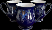 Three cobalt blue Denby mugs front view