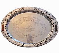 Top view of oval silver-plated tray showing pierced rim and handles