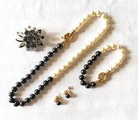 Full lot view showing necklace, bracelet, earrings pair and brooch