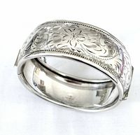 Etched floral sterling silver hinged bangle bracelet front view