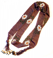 Full view of beaded sash showing length, floral motif, tassel ends