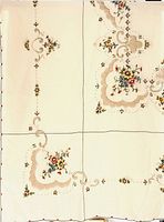 Full view of unfolded embroidered tablecloth