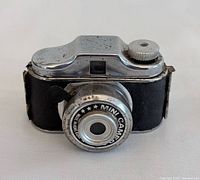 Front view showing lens bezel text and overall design