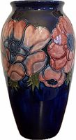 Full view of cobalt blue Moorcroft vase with anemone decoration
