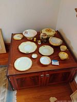 Group shot of all porcelain pieces on cabinet
