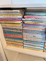 Two vertical stacks of Archie digest comics on shelf, spines visible