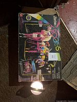 Front of worn Barbie Rockers Hot Rockin' Stage playset box showing graphics and item title