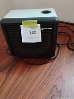 Front view of Black & Decker space heater showing grille, logo and overall condition