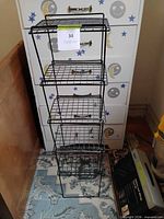 Front view showing entire five-tier black wire shelving unit