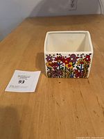 Planter front view showing floral design