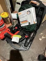 Overview of two cordless drills, batteries, extension cord and case