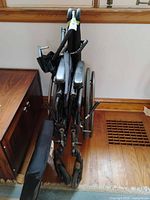 Folded manual wheelchair with footrests attached