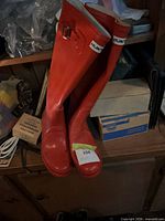 Front view of both boots showing color, height, logo, and soles