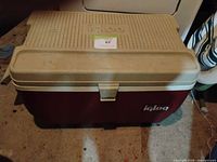 front view of Igloo cooler closed showing latch and logo