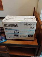 Front of Kenmore box showing brand, 43 stitch functions and model number 20 15243