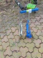 Front view of both scooters standing on pavement