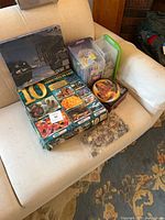 Overview of all puzzle boxes, bins and bag on chair