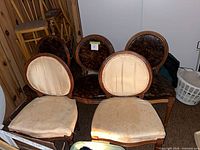 Five Louis XVI style dining chairs, two beige, three dark brown upholstery, front view