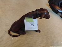 Left side view of bronze dog figurine