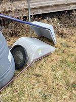 full view of tubular frame beside barrel and panels