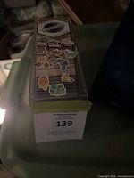 closed clear plastic card box full of cards