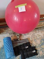Pink exercise ball with foam roller, weights, mat