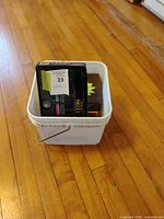 Bucket containing Wilson Ultra 500, Pinnacle, Titleist, Top-Flite XL packages