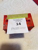 Closed red brocade box top view