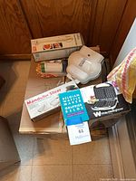 Group shot showing all boxed and loose items atop carton