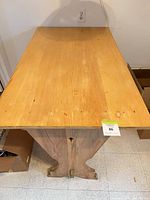top view of solid pine rectangular tabletop showing wear and replaced top