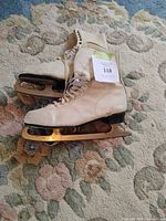 Side view of both skates showing boot material and blades